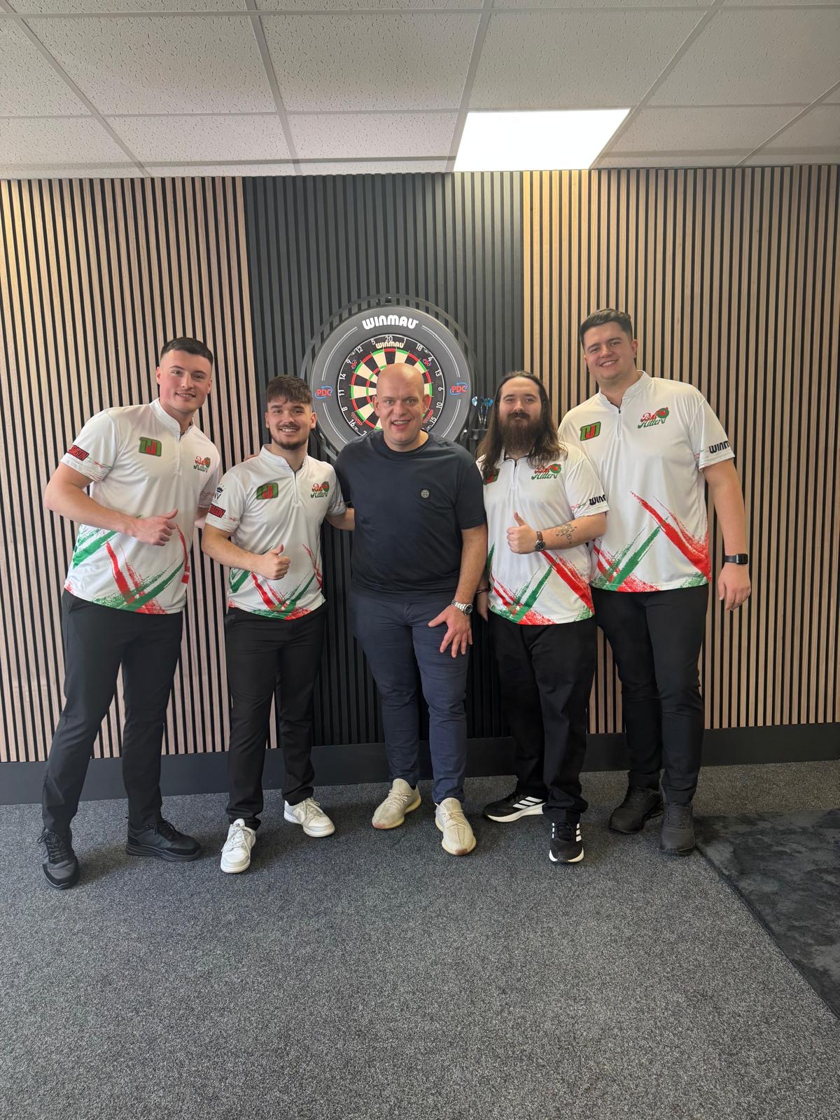 The BullHitters team with Michael van Gerwen at a professional darts setup
