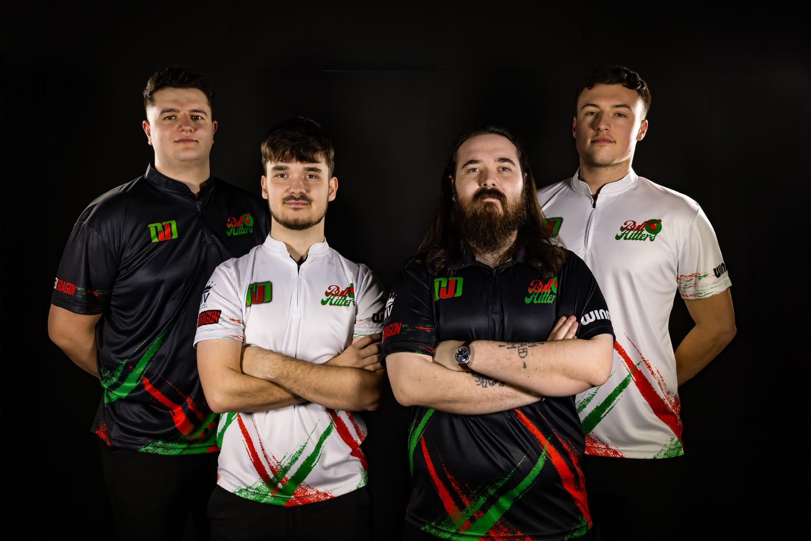 The four BullHitters creators .  Ollie Howard (TBD Darts), Bailey and Dan McNamara (McDarts), and Daniel Coates (Darts With DC). In their collective team shirts