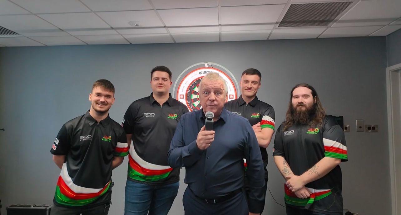 The BullHitters team behind the scenes at a darts competition