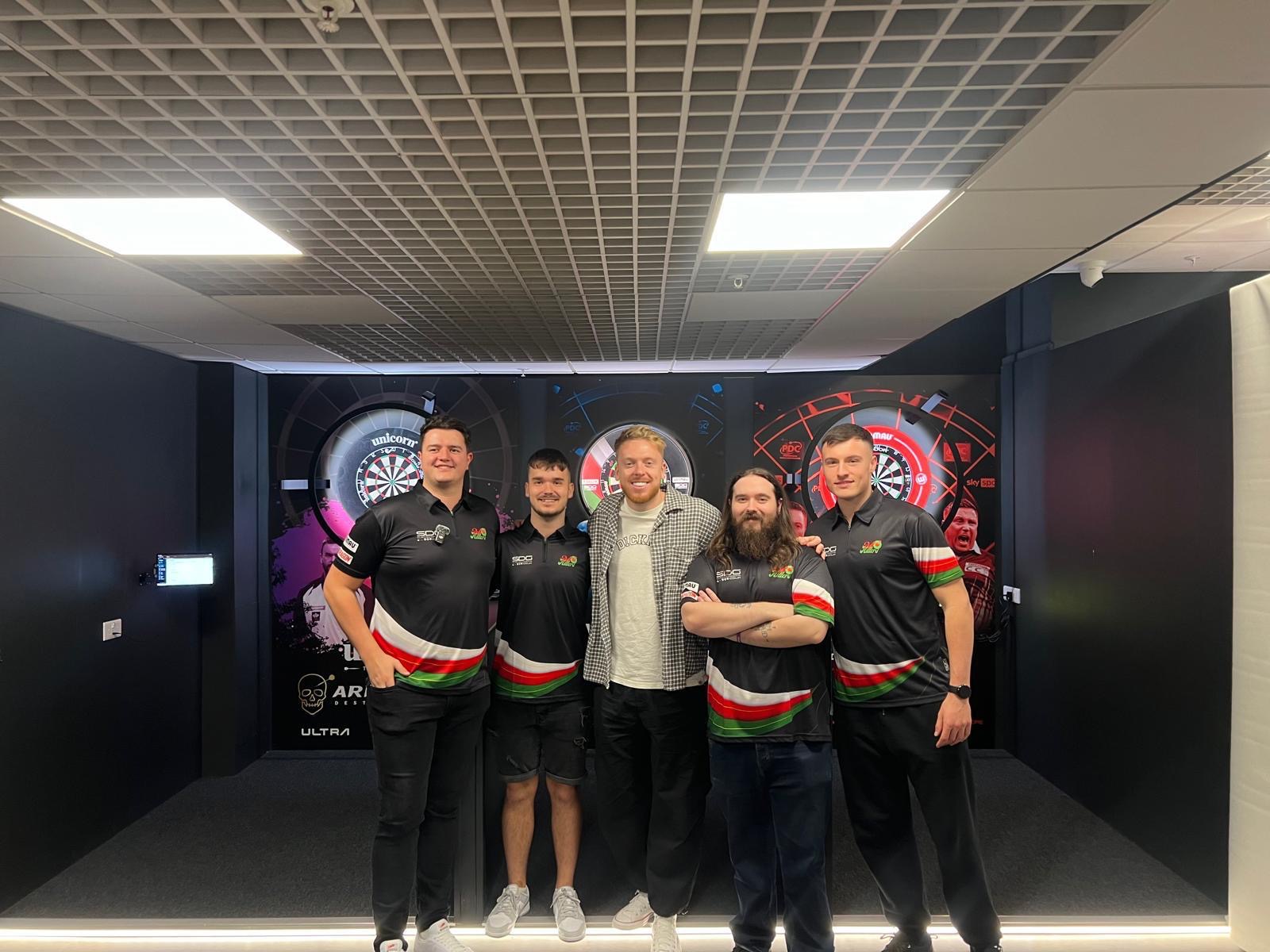 The BullHitters team with a guest at the practice room